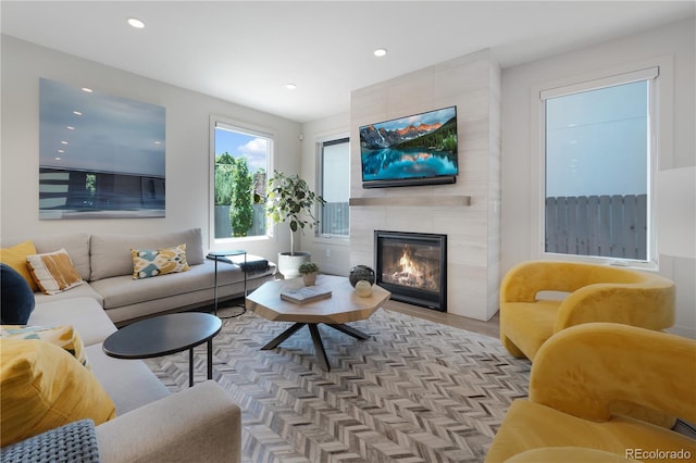 3450 S Cherry St, Denver, CO 80222 - living area with recessed lighting, a tile fireplace, and wood finished floors
