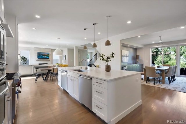 3450 S Cherry St, Denver, CO 80222 - kitchen featuring dishwasher, wood finished floors, white cabinetry, recessed lighting, and light countertops