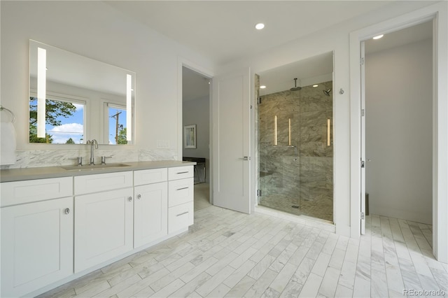 3450 S Cherry St, Denver, CO 80222 - bathroom with a stall shower, vanity, and recessed lighting