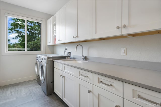 3450 S Cherry St, Denver, CO 80222 - washroom featuring cabinet space and washer and clothes dryer