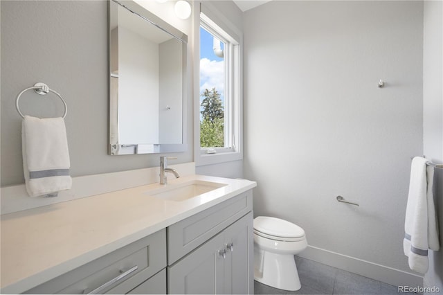 3450 S Cherry St, Denver, CO 80222 - bathroom featuring healthy amount of natural light, vanity, and tile patterned floors