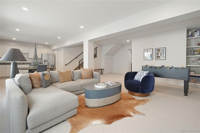 3450 S Cherry St, Denver, CO 80222 - living room with recessed lighting, stairway, and light colored carpet