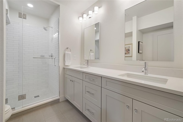 3450 S Cherry St, Denver, CO 80222 - full bath featuring a stall shower, double vanity, and tile patterned floors