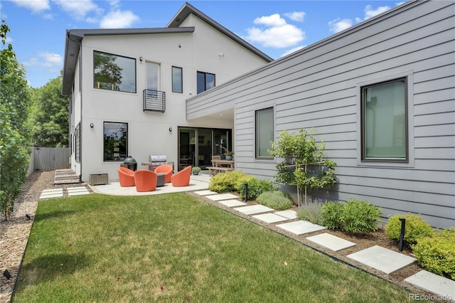 3450 S Cherry St, Denver, CO 80222 - back of property featuring a balcony, an outdoor living space, a patio, and stucco siding