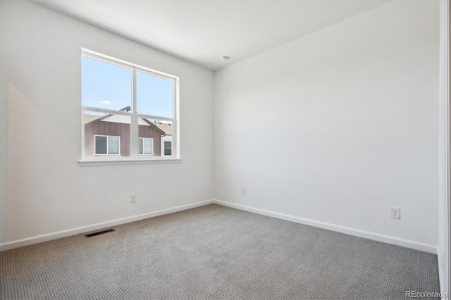 empty room featuring carpet floors