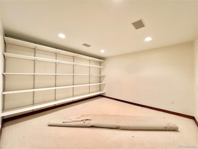 interior space featuring visible vents, recessed lighting, baseboards, and carpet flooring