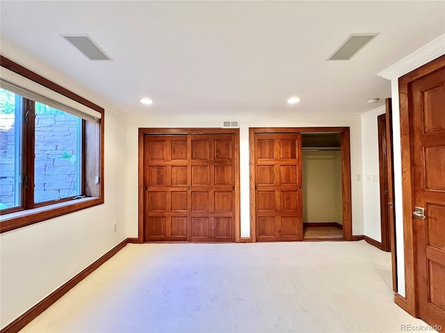 unfurnished bedroom featuring light colored carpet, baseboards, visible vents, and recessed lighting