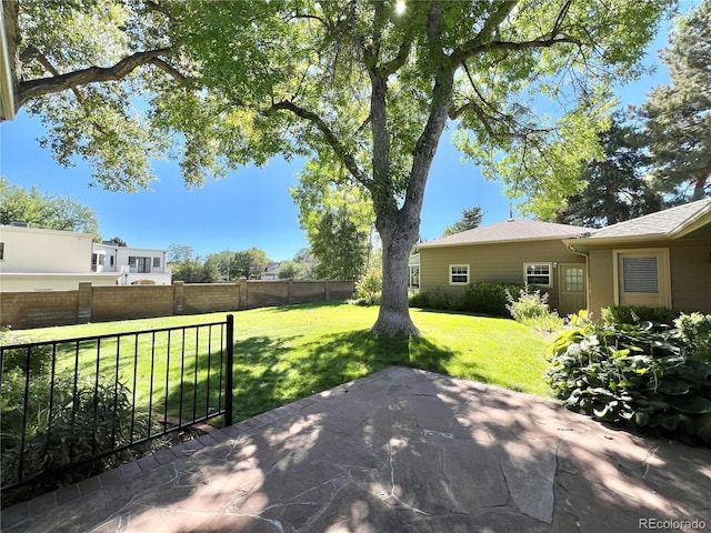 view of patio featuring fence