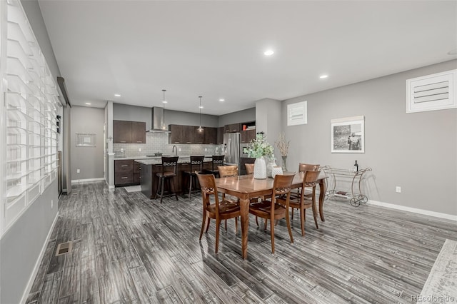 dining room with visible vents, recessed lighting, dark wood-style floors, and baseboards