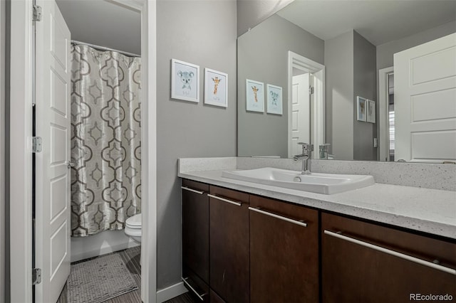 bathroom with toilet and vanity