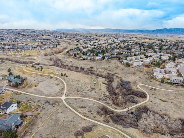 birds eye view of property featuring a mountain view and a residential view