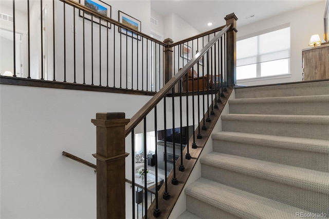 stairs featuring visible vents and recessed lighting