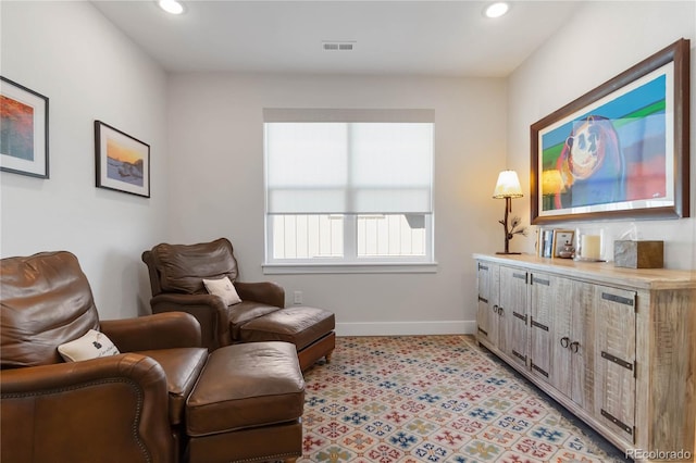 sitting room featuring baseboards, visible vents, and recessed lighting