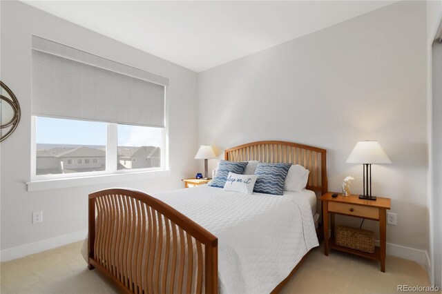 bedroom featuring baseboards and carpet flooring