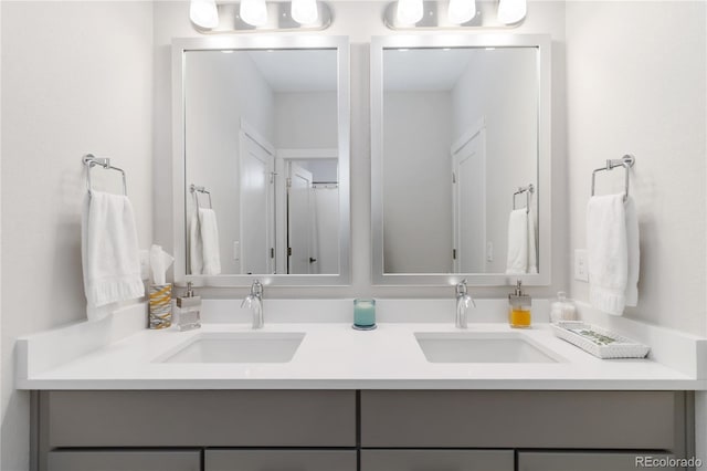 bathroom with double vanity and a sink