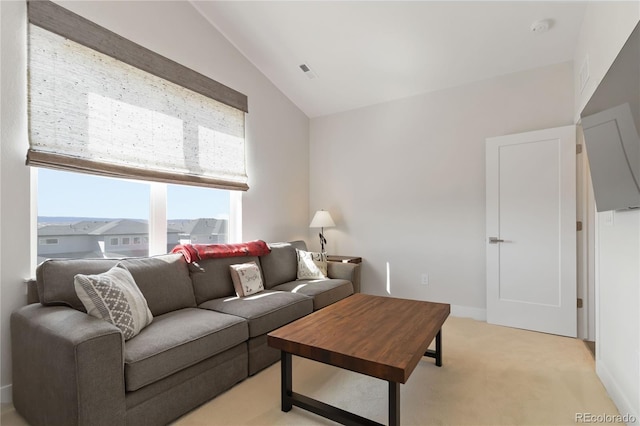 living room featuring light carpet, lofted ceiling, visible vents, and baseboards