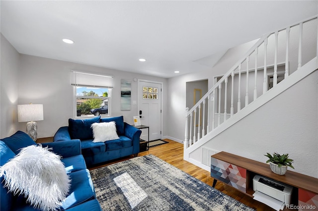 5570 Otis Ct, Arvada, CO 80002 - living area with stairway, wood finished floors, recessed lighting, and baseboards