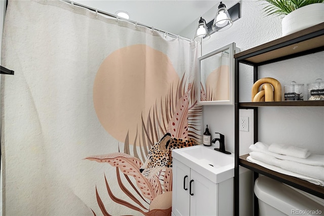 5570 Otis Ct, Arvada, CO 80002 - bathroom with vanity, toilet, and curtained shower