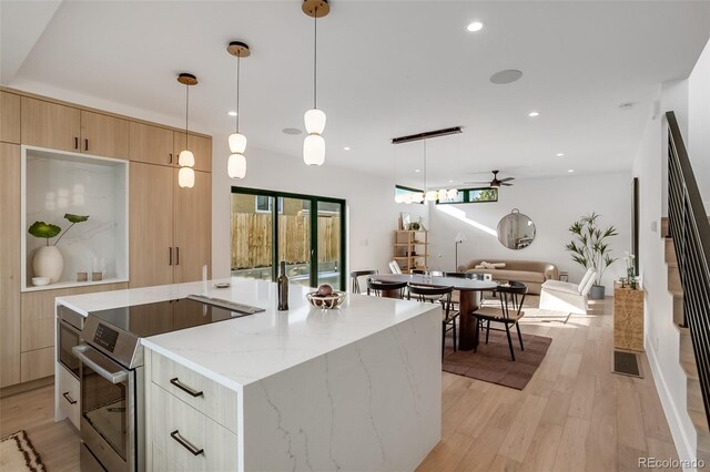 1459 W 42nd Ave, Denver, CO 80211 - kitchen featuring electric range, light brown cabinetry, modern cabinets, ceiling fan, and light wood finished floors
