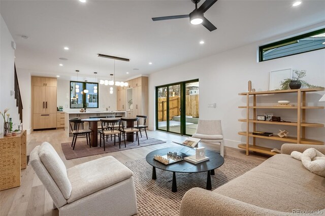 1459 W 42nd Ave, Denver, CO 80211 - living room with plenty of natural light, recessed lighting, and light wood-style flooring