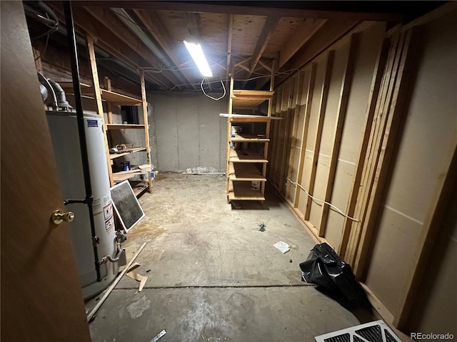 unfinished basement with gas water heater