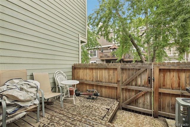 1198 Milo Cir Unit A, Lafayette, CO 80026 - view of patio / terrace with fence, a gate, and a wooden deck