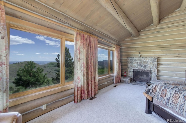 51 W Ranch Trl, Morrison, CO 80465 - carpeted bedroom featuring log walls, wood ceiling, and a stone fireplace