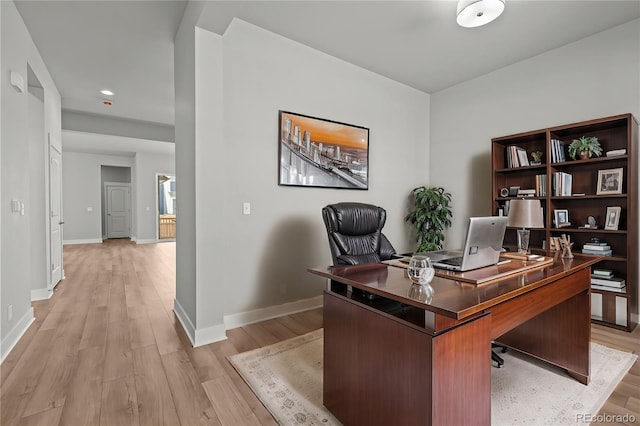 21204 E 63rd Dr, Aurora, CO 80019 - office area featuring light wood finished floors and baseboards