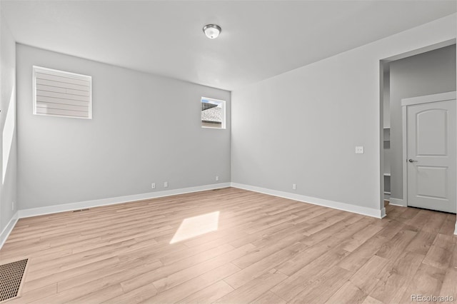 21204 E 63rd Dr, Aurora, CO 80019 - spare room featuring visible vents, light wood finished floors, and baseboards