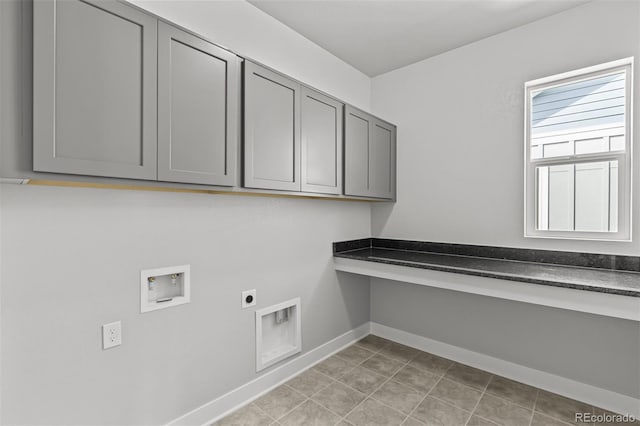 21204 E 63rd Dr, Aurora, CO 80019 - laundry room with electric dryer hookup, baseboards, hookup for a washing machine, and cabinet space