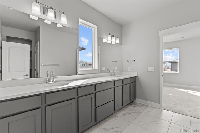 21204 E 63rd Dr, Aurora, CO 80019 - full bath with plenty of natural light, a sink, and double vanity