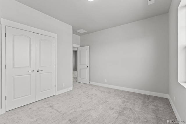21204 E 63rd Dr, Aurora, CO 80019 - unfurnished bedroom featuring carpet floors, a closet, baseboards, and visible vents