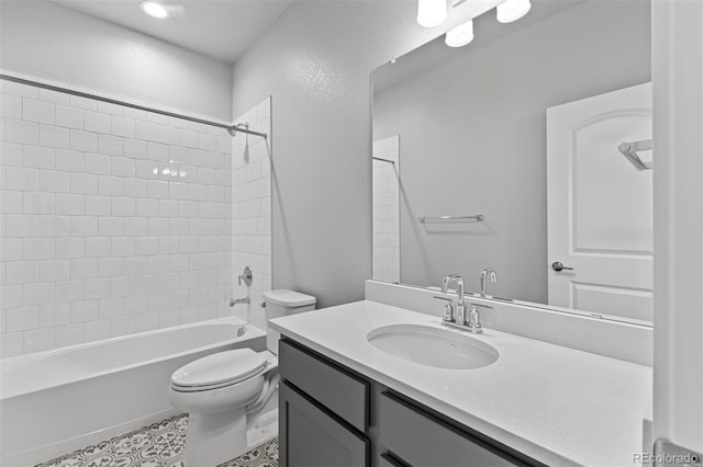 21204 E 63rd Dr, Aurora, CO 80019 - full bathroom featuring tile patterned floors, toilet, shower / bathing tub combination, a textured wall, and vanity