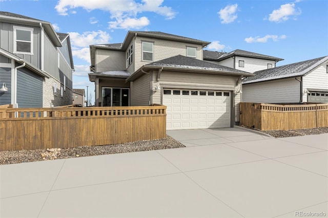 21204 E 63rd Dr, Aurora, CO 80019 - view of front of house with fence, driveway, and a garage