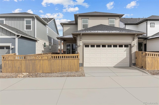 21204 E 63rd Dr, Aurora, CO 80019 - view of front facade with concrete driveway, fence, and a garage
