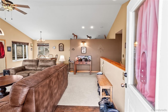 612 Sheep Ridge Rd, Fairplay, CO 80440 - carpeted living area with vaulted ceiling, ceiling fan, and a chandelier