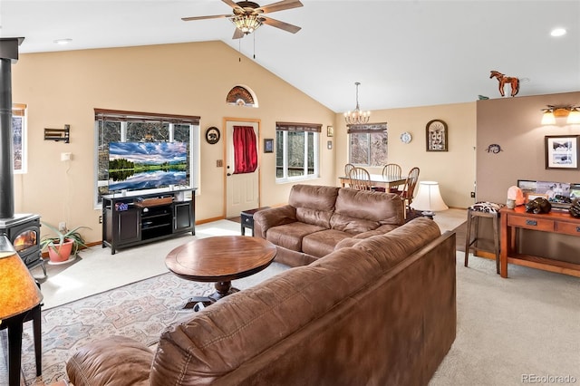 612 Sheep Ridge Rd, Fairplay, CO 80440 - living room with light colored carpet, a wood stove, ceiling fan, a chandelier, and lofted ceiling