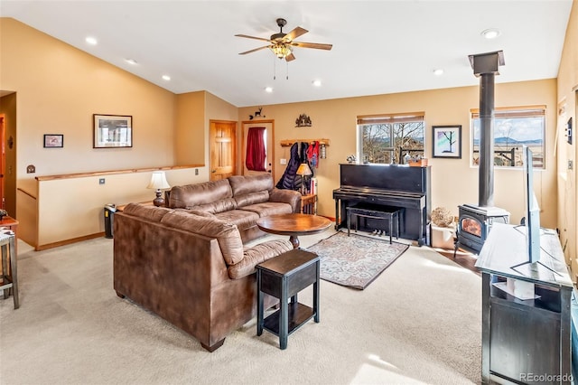 612 Sheep Ridge Rd, Fairplay, CO 80440 - living area featuring light carpet, ceiling fan, a wood stove, lofted ceiling, and recessed lighting
