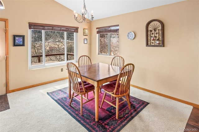 612 Sheep Ridge Rd, Fairplay, CO 80440 - dining area with a chandelier, vaulted ceiling, and carpet flooring
