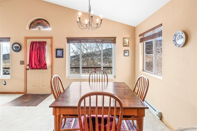 612 Sheep Ridge Rd, Fairplay, CO 80440 - carpeted dining space with baseboard heating, a chandelier, lofted ceiling, and healthy amount of natural light