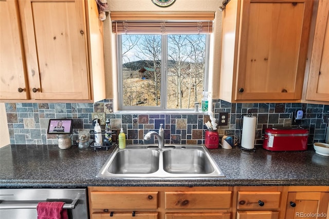 612 Sheep Ridge Rd, Fairplay, CO 80440 - kitchen featuring stainless steel dishwasher, dark countertops, and decorative backsplash