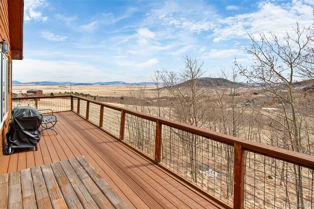 612 Sheep Ridge Rd, Fairplay, CO 80440 - wooden deck with grilling area and a mountain view