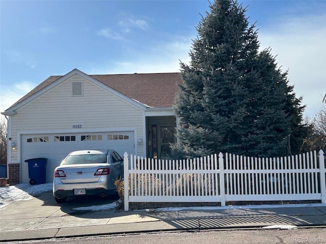 ranch-style house featuring a garage