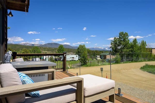 151 County Road 644, Grand Lake, CO 80447 - view of patio / terrace featuring a deck with mountain view and an outdoor living space