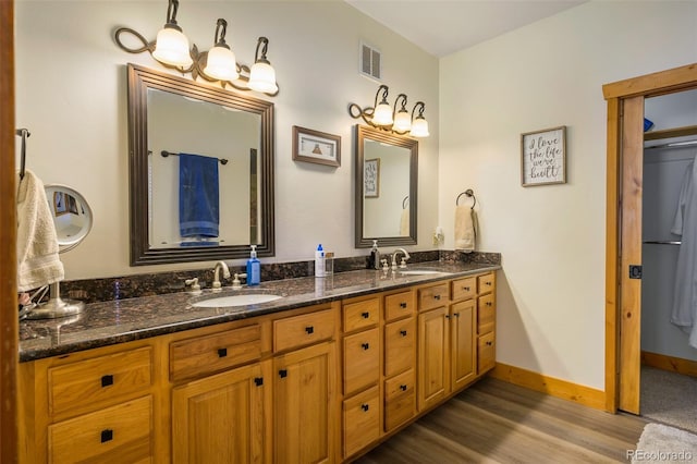 151 County Road 644, Grand Lake, CO 80447 - full bath featuring double vanity and wood finished floors