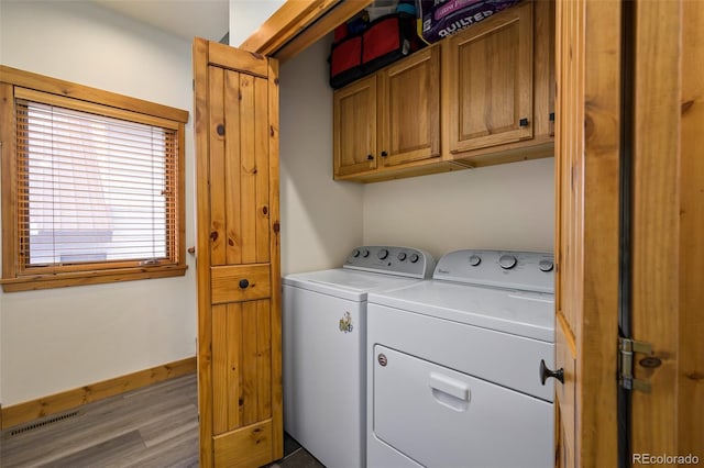 151 County Road 644, Grand Lake, CO 80447 - washroom with washing machine and dryer, cabinet space, and wood finished floors