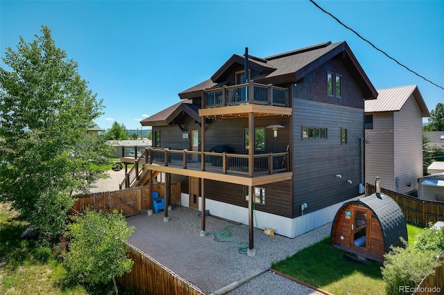 151 County Road 644, Grand Lake, CO 80447 - rear view of property with a balcony, a fenced backyard, and a patio area