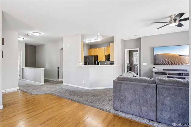 19677 E Vassar Dr, Aurora, CO 80013 - living room featuring light wood finished floors and a ceiling fan