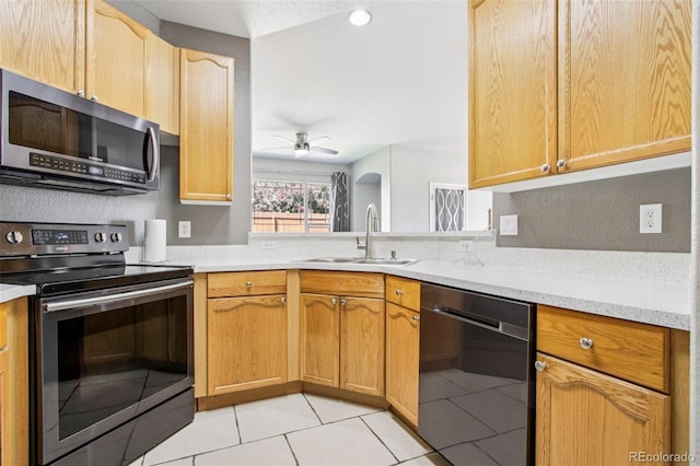 19677 E Vassar Dr, Aurora, CO 80013 - kitchen with appliances with stainless steel finishes, ceiling fan, and light tile patterned floors