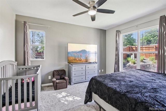 19677 E Vassar Dr, Aurora, CO 80013 - carpeted bedroom featuring multiple windows and ceiling fan